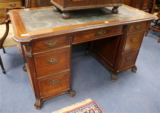 A Continental mahogany kneehole desk W.148cm